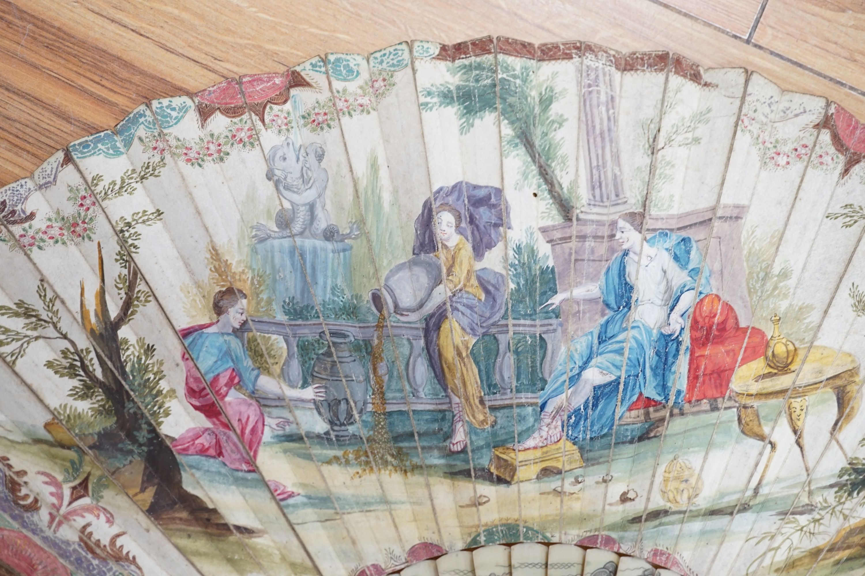 Five various fans, and an 18th century painted leaf fan with ivory chinoiserie decorated guards and sticks, 28 cms high (6)